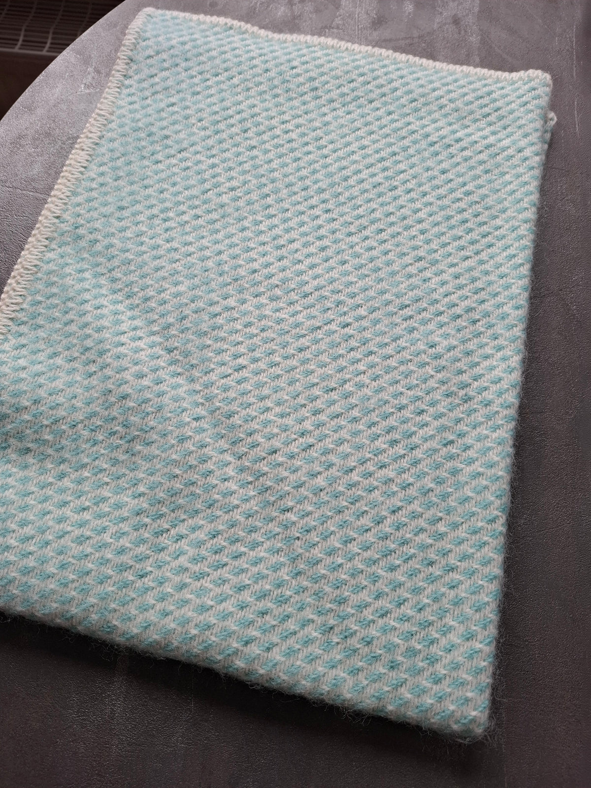 Wollen wiegdeken in verschillende kleuren
